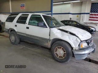 1996 GMC Jimmy SL with VIN 1GKDT13W4T2572197, listed as a Copart auction lot 76535534 with 157,624 mi miles and Salvage Title. Bid and sale history available at carsss.com. Image 4.