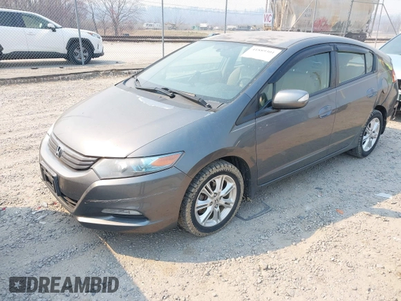 2010 Honda Insight EX with VIN JHMZE2H75AS027964, listed as a IAAI auction lot 41889301 with 136,485 mi miles and . Bid and sale history available at DreamBid. Image 2.