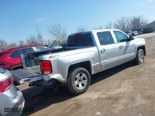2015 Chevrolet Silverado 1500 LT with VIN 3GCUKREC0FG316716, listed as a IAAI auction lot 41908921 with 242,093 mi miles. Bid and sale history available at carsss.com. Image 4.