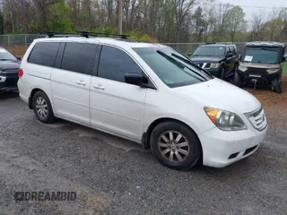 2010 Honda Odyssey EX-L with VIN 5FNRL3H65AB068497, listed as a IAAI auction lot 42013925 with 206,668 mi miles. Bid and sale history available at carsss.com. Image 1.