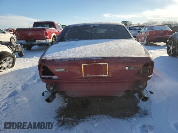 1999 Jaguar XJ with VIN SAJPD1841XC869913, listed as a Copart auction lot 41449445 with Not provided miles and Salvage title. Bid and sale history available at DreamBid. Image 6.