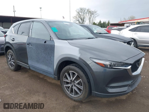 2017 Mazda CX-5 Grand Touring with VIN JM3KFBDL3H0143194, listed as a IAAI auction lot 42049258 with 74,159 mi miles. Bid and sale history available at carsss.com. Image 1.