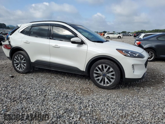 2020 Ford Escape Titanium with VIN 1FMCU9J91LUC38161, listed as a Copart auction lot 64293535 with 48,682 mi miles and Salvage title. Bid and sale history available at DreamBid. Image 4.