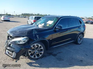 2018 BMW X5 xDrive40e iPerformance with VIN 5UXKT0C59J0W00801, listed as a IAAI auction lot 41081133 with 63,265 mi miles. Bid and sale history available at carsss.com. Image 2.