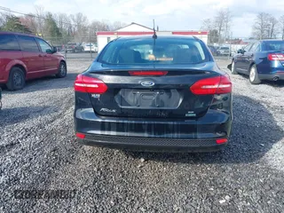 2018 Ford Focus SE z VIN 1FADP3FE9JL255818, wystawiony jako IAAI lot #42009017 z przebiegiem 79 329 mil mil oraz . Historia ofert i sprzedaży dostępna na DreamBid. Obrazek 17.
