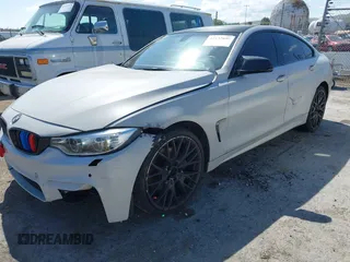 2015 BMW 4 Series 428i xDrive with VIN WBA4C9C54FD330582, listed as a IAAI auction lot 42135691 with 127,289 mi miles and . Bid and sale history available at DreamBid. Image 2.