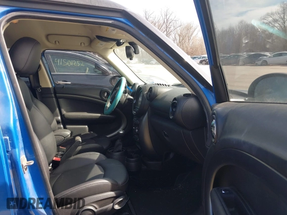 2014 MINI Countryman S with VIN WMWZC5C54EWM17299, listed as a IAAI auction lot 41655370 with 104,264 mi miles and . Bid and sale history available at DreamBid. Image 5.