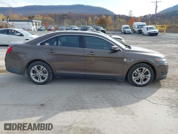 2015 Ford Taurus SEL with VIN 1FAHP2H87FG199865, listed as a IAAI auction lot 40760225 with 77,782 mi miles. Bid and sale history available at carsss.com. Image 13.