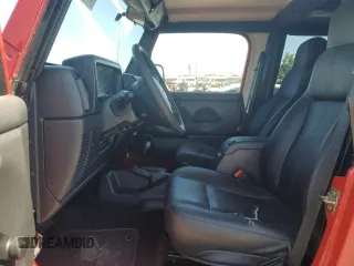 2004 Jeep Wrangler Sport with VIN 1J4FA49S24P720488, listed as a Copart auction lot 60331795 with 134,974 mi miles and Salvage title. Bid and sale history available at DreamBid. Image 7.