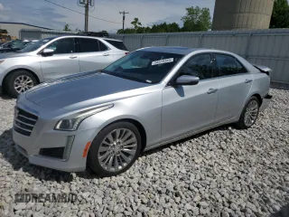 2015 Cadillac CTS Luxury AWD with VIN 1G6AX5SX7F0135401, listed as a Copart auction lot 58519385 with 102,763 mi miles and Clean title. Bid and sale history available at DreamBid. Image 1.