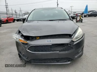 2016 Ford Focus SE z VIN 1FADP3F23GL405565, wystawiony jako Copart lot #60173935 z przebiegiem 82 167 mil mil oraz Szkoda całkowita • Salvage title. Historia ofert i sprzedaży dostępna na DreamBid. Obrazek 5.