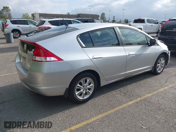2010 Honda Insight EX with VIN JHMZE2H75AS003695, listed as a IAAI auction lot 42119429 with 90,901 mi miles and . Bid and sale history available at DreamBid. Image 4.