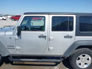 2010 Jeep Wrangler Unlimited Sport with VIN 1J4BA3H17AL211887, listed as a IAAI auction lot 41778324 with 185,626 mi miles. Bid and sale history available at carsss.com. Image 14.