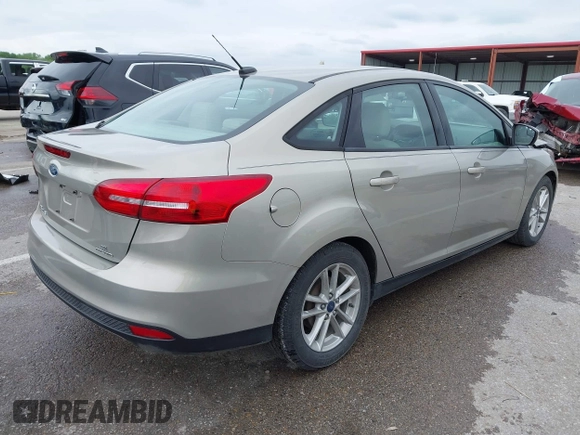 2016 Ford Focus SE z VIN 1FADP3F26GL332224, wystawiony jako IAAI lot #42167222 z przebiegiem 134 423 mil mil oraz . Historia ofert i sprzedaży dostępna na DreamBid. Obrazek 4.