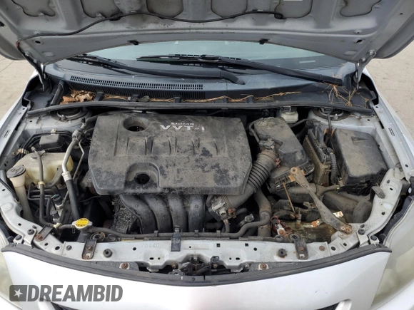 2010 Toyota Corolla z VIN 2T1BU4EE1AC260665, wystawiony jako Copart lot #60441805 z przebiegiem 173 521 mil mil oraz Szkoda całkowita • Salvage title. Historia ofert i sprzedaży dostępna na DreamBid. Obrazek 11.