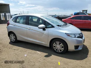 2015 Honda Fit LX with VIN 3HGGK5H59FM709104, listed as a Copart auction lot 63569065 with 101,859 mi miles and Salvage title. Bid and sale history available at DreamBid. Image 4.