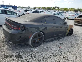 2019 Dodge Charger SRT Hellcat z VIN 2C3CDXL99KH671724, wystawiony jako Copart lot #56719475 z przebiegiem Nie podano mil oraz Szkoda całkowita • Salvage title. Historia ofert i sprzedaży dostępna na DreamBid. Obrazek 3.