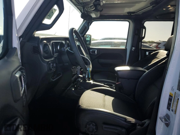 2023 Jeep Wrangler Sport S with VIN 1C4HJXDNXPW569699, listed as a Copart auction lot 52392145 with 32,972 mi miles and Salvage title. Bid and sale history available at DreamBid. Image 7.