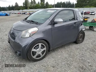 2013 Scion iQ with VIN JTNJJXB01DJ023919, listed as a Copart auction lot 61599075 with 91,920 mi miles and Salvage title. Bid and sale history available at DreamBid. Image 1.