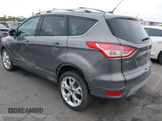 2013 Ford Escape Titanium with VIN 1FMCU0J9XDUD86354, listed as a IAAI auction lot 42420780 with 260,995 mi miles and . Bid and sale history available at DreamBid. Image 3.