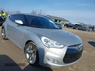 2012 Hyundai Veloster w/Black Int with VIN KMHTC6AD7CU063968, listed as a IAAI auction lot 41764263 with 83,634 mi miles and . Bid and sale history available at DreamBid. Image 1.