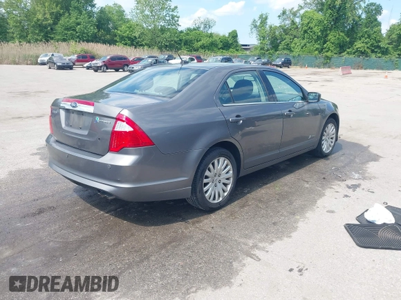 2011 Ford Fusion Hybrid with VIN 3FADP0L32BR132155, listed as a IAAI auction lot 42196233 with 77,900 mi miles and . Bid and sale history available at DreamBid. Image 4.