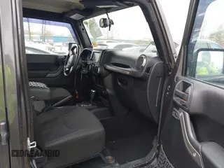 2014 Jeep Wrangler Unlimited Sport with VIN 1C4BJWDG6EL239378, listed as a IAAI auction lot 42073392 with 120,999 mi miles. Bid and sale history available at carsss.com. Image 5.