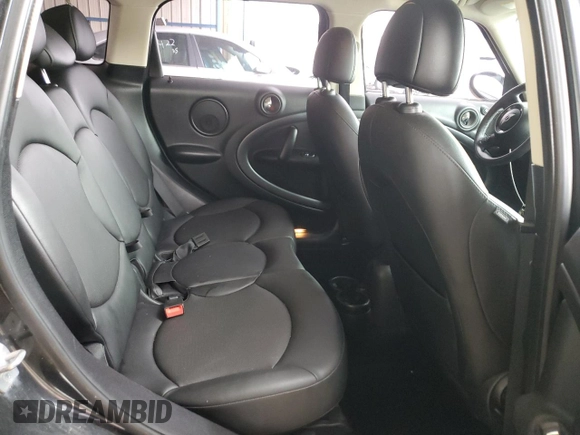 2014 MINI Countryman S with VIN WMWZC5C56EWP38065, listed as a Copart auction lot 59518395 with 91,106 mi miles and Salvage title. Bid and sale history available at DreamBid. Image 10.
