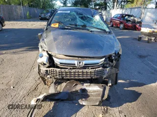 2012 Honda Insight EX z VIN JHMZE2H72CS006248, wystawiony jako Copart lot #73184844 z przebiegiem Nie podano mil oraz Szkoda całkowita • Salvage title. Historia ofert i sprzedaży dostępna na DreamBid. Obrazek 5.