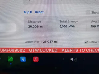 2021 Tesla Model 3 Standard Range Plus with VIN 5YJ3E1EA0MF099562, listed as a IAAI auction lot 41771323 with 26,087 mi miles. Bid and sale history available at carsss.com. Image 7.
