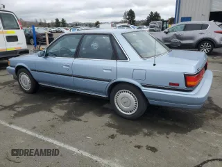1990 Toyota Camry z VIN JT2VV22EXL3011563, wystawiony jako Copart lot #46136565 z przebiegiem 63 819 mil mil oraz Czysty tytuł • Clean title. Historia ofert i sprzedaży dostępna na DreamBid. Obrazek 2.