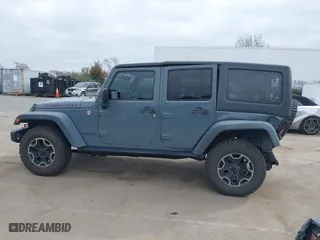 2015 Jeep Wrangler Unlimited Rubicon Hard Rock with VIN 1C4HJWFG1FL679873, listed as a IAAI auction lot 41508722 with 97,165 mi miles. Bid and sale history available at carsss.com. Image 14.