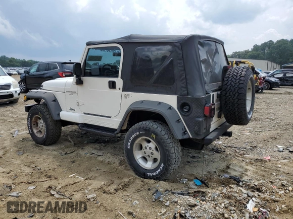 2000 Jeep Wrangler Sahara with VIN 1J4FA59SXYP760278, listed as a Copart auction lot 60402485 with 192,161 mi miles and Salvage title. Bid and sale history available at DreamBid. Image 2.