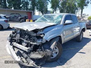 2018 Toyota Tacoma SR with VIN 5TFAX5GN2JX103685, listed as a IAAI auction lot 42392032 with 138,678 mi miles and . Bid and sale history available at DreamBid. Image 2.