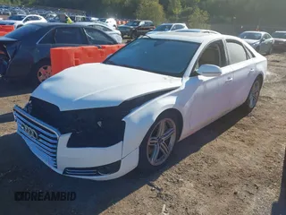 2013 Audi A8 4.0L with VIN WAUA2AFD9DN017867, listed as a IAAI auction lot 40430651 with 114,928 mi miles and . Bid and sale history available at DreamBid. Image 2.