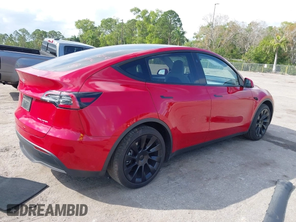 2023 Tesla Model Y Long Range with VIN 7SAYGDEE1PA154996, listed as a IAAI auction lot 41472595 with 24,861 mi miles and . Bid and sale history available at DreamBid. Image 4.