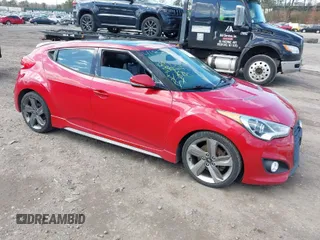 2015 Hyundai Veloster Turbo with VIN KMHTC6AE2FU225468, listed as a IAAI auction lot 41957815 with 129,596 mi miles. Bid and sale history available at carsss.com. Image 1.