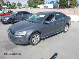 2013 Volkswagen Jetta Hybrid SE with VIN 3VW637AJ3DM305798, listed as a IAAI auction lot 42736297 with 156,972 mi miles and . Bid and sale history available at DreamBid. Image 2.