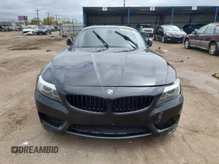 2011 BMW Z4 sDrive35i z VIN WBALM7C51BE383595, wystawiony jako Copart lot #54887695 z przebiegiem Nie podano mil oraz Szkody całkowita. Historia ofert i sprzedaży dostępna na DreamBid. Obrazek 5.