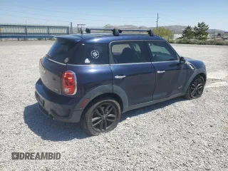 2013 MINI Countryman S ALL4 with VIN WMWZC5C50DWM15256, listed as a Copart auction lot 58080895 with 123,514 mi miles and Salvage title. Bid and sale history available at DreamBid. Image 3.