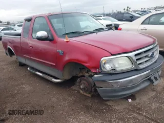 2002 Ford F-150 XL with VIN 1FTRX17W72NB88475, listed as a IAAI auction lot 41574244 with 200,396 mi miles. Bid and sale history available at carsss.com. Image 1.