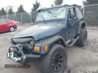 2003 Jeep Wrangler X with VIN 1J4FA39S23P300447, listed as a IAAI auction lot 41791733 with 165,576 mi miles. Bid and sale history available at carsss.com. Image 6.