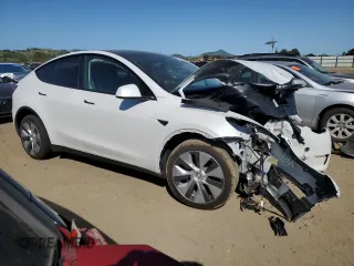 2024 Tesla Model Y Long Range with VIN 7SAYGDEE0RF081948, listed as a Copart auction lot 52612805 with 12,099 mi miles and Salvage Title. Bid and sale history available at DreamBid. Image 4.