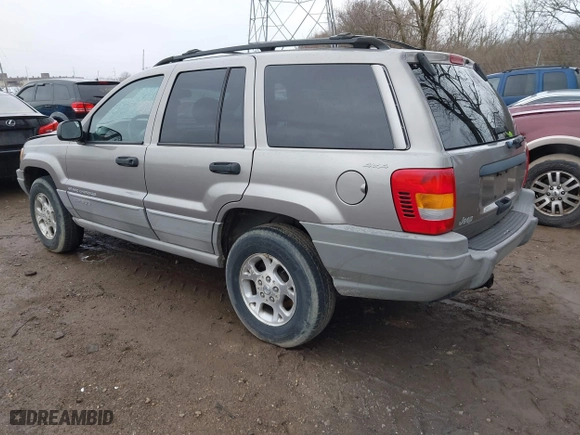 1999 Jeep Grand Cherokee Laredo with VIN 1J4GW58N0XC748809, listed as a IAAI auction lot 41722910 with 201,407 mi miles. Bid and sale history available at carsss.com. Image 3.