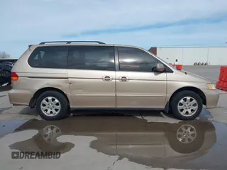 2002 Honda Odyssey EX-L z VIN 2HKRL18042H567858, wystawiony jako IAAI lot #41686147 z przebiegiem 264 570 mil mil oraz . Historia ofert i sprzedaży dostępna na DreamBid. Obrazek 13.