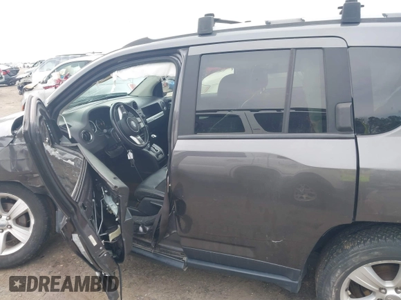 2016 Jeep Compass Latitude with VIN 1C4NJDEB4GD687300, listed as a IAAI auction lot 41800186 with 169,374 mi miles. Bid and sale history available at carsss.com. Image 14.