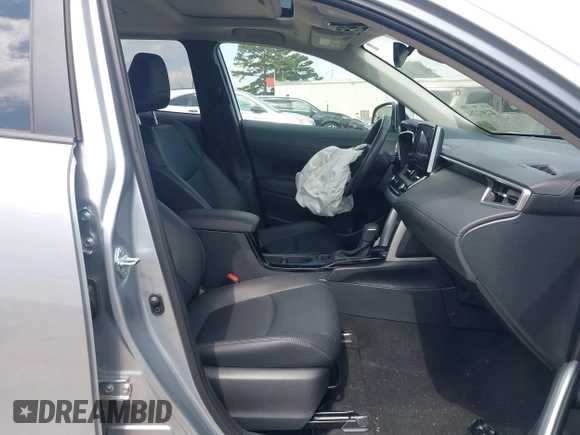 2023 Toyota Corolla Cross XLE with VIN 7MUDAAAG0PV057750, listed as a IAAI auction lot 42302284 with 31,404 mi miles and . Bid and sale history available at DreamBid. Image 5.
