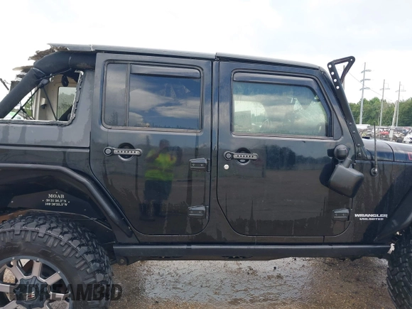 2015 Jeep Wrangler Unlimited Rubicon Hard Rock with VIN 1C4HJWFG0FL674700, listed as a IAAI auction lot 42511949 with 138,370 mi miles and . Bid and sale history available at DreamBid. Image 13.