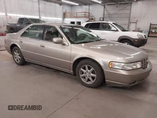 2004 Cadillac Seville Luxury SLS z VIN 1G6KS54Y74U163861, wystawiony jako IAAI lot #41881291 z przebiegiem 215 518 mil mil oraz . Historia ofert i sprzedaży dostępna na DreamBid. Obrazek 1.