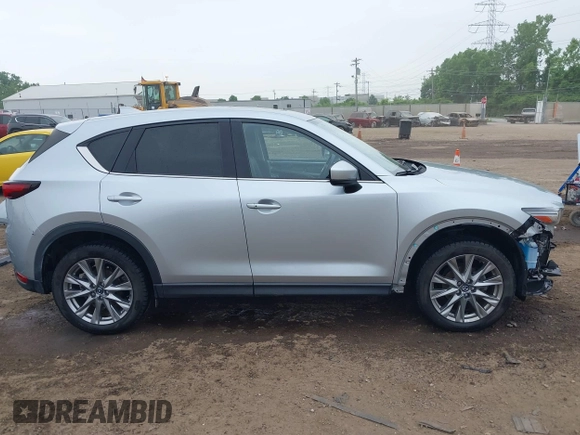2021 Mazda CX-5 Grand Touring with VIN JM3KFBDM4M0371496, listed as a IAAI auction lot 42428860 with 113,735 mi miles and . Bid and sale history available at DreamBid. Image 14.